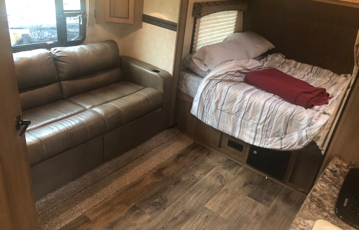 Couch and bed.  Slide out provides enough space for a queen air mattress.