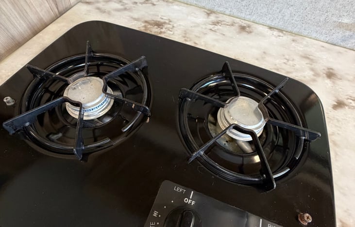 A convenient two-burner cooktop for easy indoor cooking during your trip.