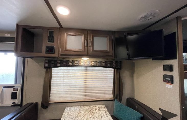 TV with DVD player and capable of being connected to a cable hookup if available at a campsite.