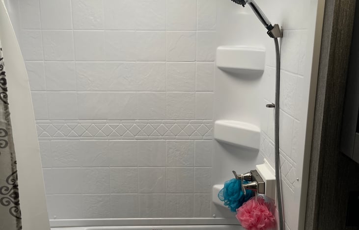 Spacious shower plenty of room to enjoy a nice shower after swimming in the lake or river