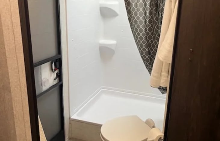 Shower with skylight and an exterior door for direct access to shower when needed