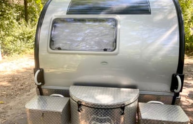 Front storage, solar panel, window, pull handles.