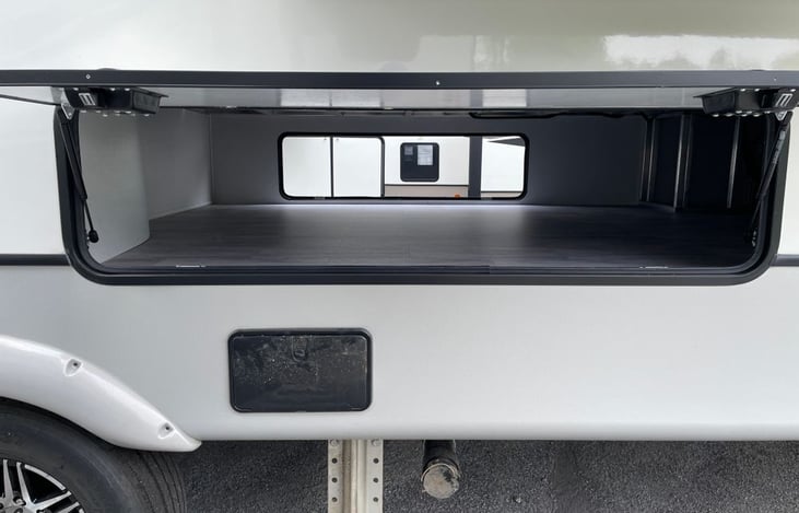 Large pass-through storage underneath fits anything you need for your trip.