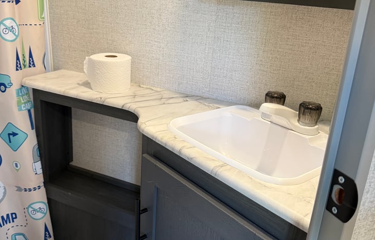 Main bathroom sink. One roll of toilet paper and hand soap available. Freshly washed towels and cloths available upon request.