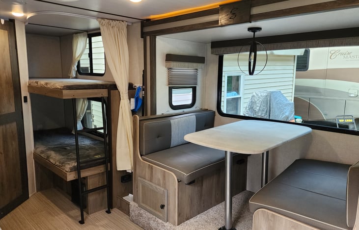 Bunks with windows and outlet for phone charger. Includes bed linen