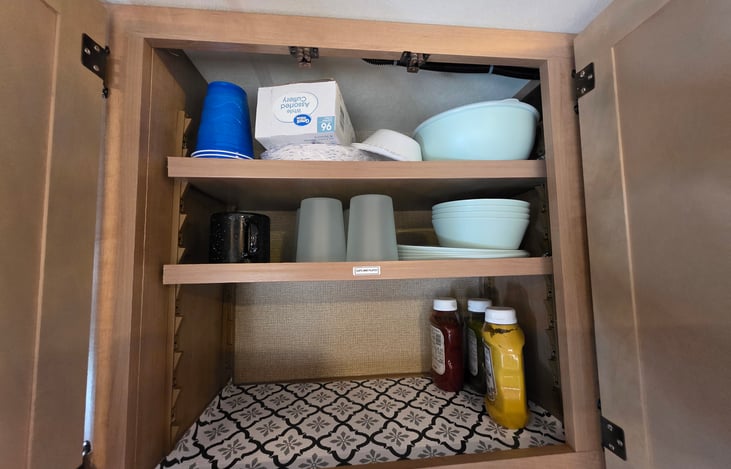 4 sets of plates, bowls, glasses. One time use paper plates, forks and spoon.