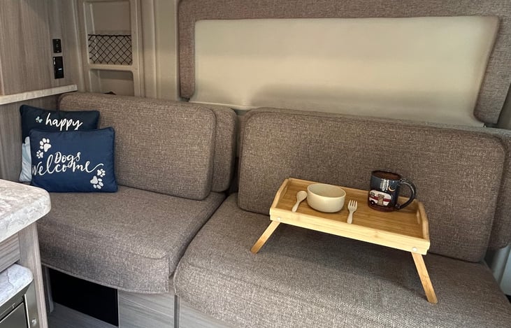 Seating area that pulls out to a bed.  Table replacement.  Original table removed.