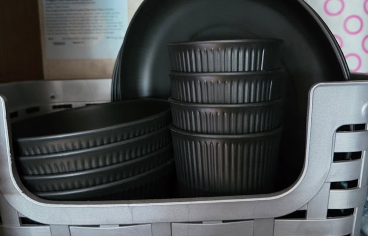 Motorhome comes stocked with basic cooking essentials, cups, plates, bowls, and silverware.