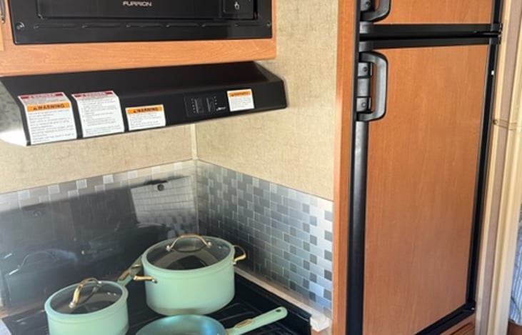 Kitchen! Fridge, stove, and microwave.