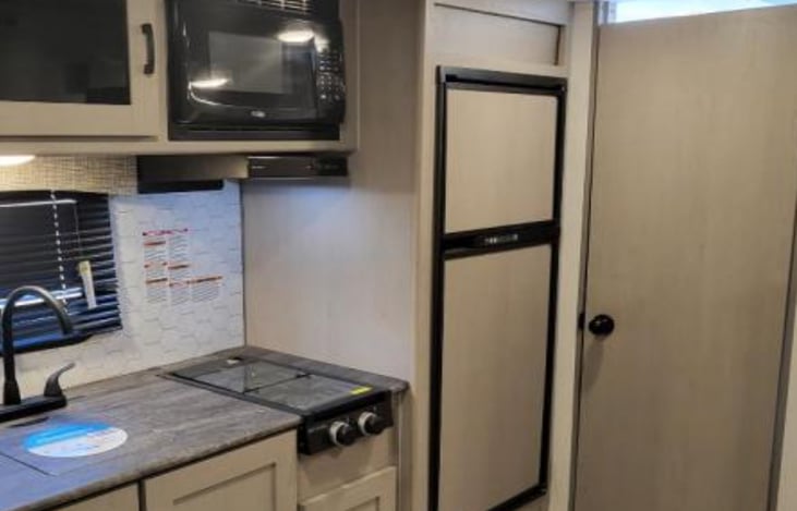 Kitchen area with microwave