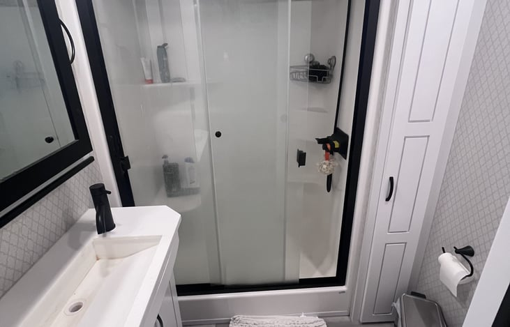 Large roomy bathroom and shower.