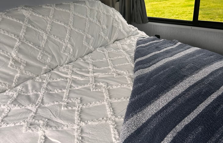 Plush and comfortable king size bed with 3 inch gel foam mattress topper and soft pillows for a resort style restful night