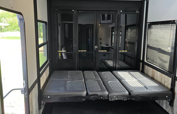 Toy room, with it own bath room and shower. It has another top queen that also comes down. Cool Rig.
