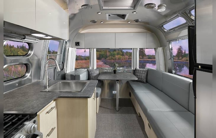 Dining table (opens to hatch) that lowers for more sleeping space.