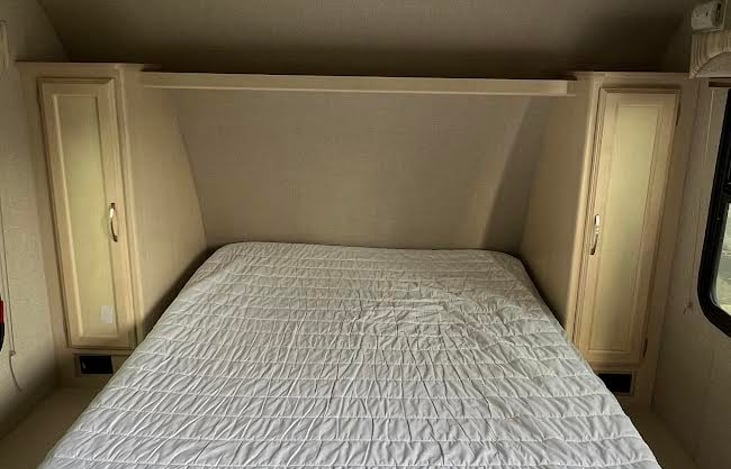 Queen size Murphy bed folds down from the wall for a comfortable night's sleep.