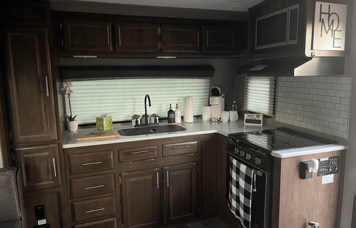 Fully Stocked Kitchen with plenty of cabinets and prep space.