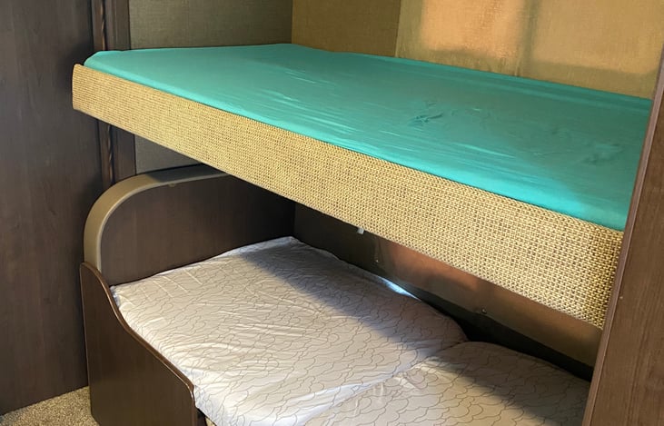 The kids will argue on who sleeps on top but both with a TV