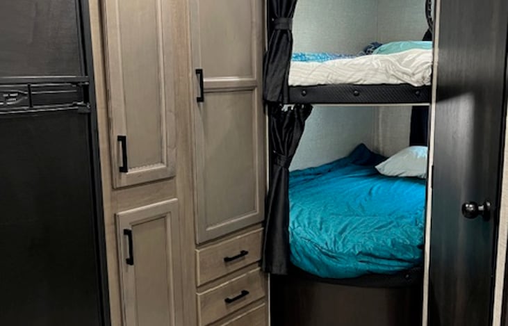 Bunk house with 2 full-size bunk beds! 
(it's enough room for my 6' tall son to sleep comfortably and not hang off the end).