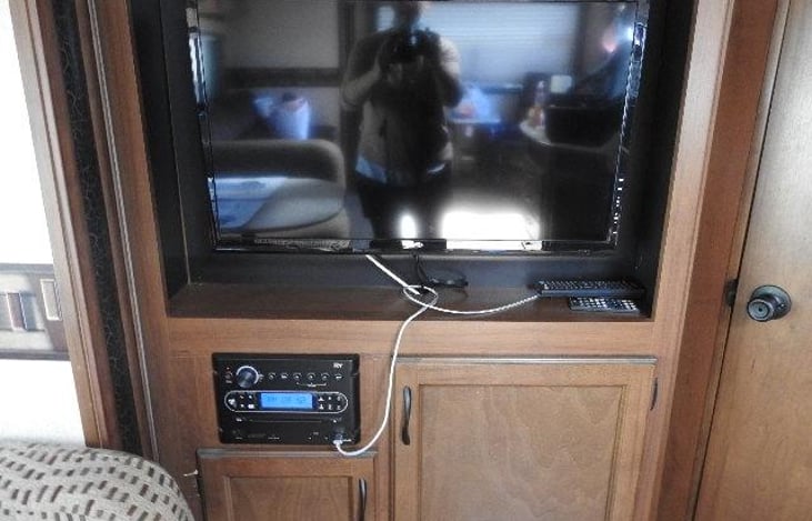 Antenna crank near front door, remote under TV