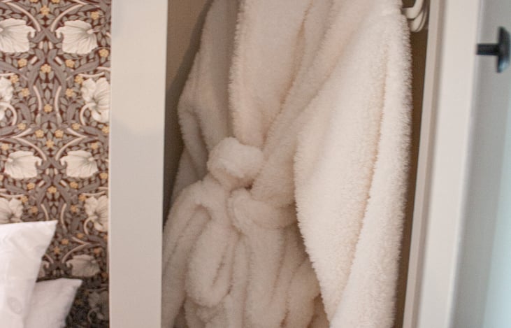 Stay organized and ready for adventure in the well-appointed primary bedroom closets, complete with a luxurious robe.