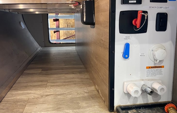 Full width storage with all plumbing controls