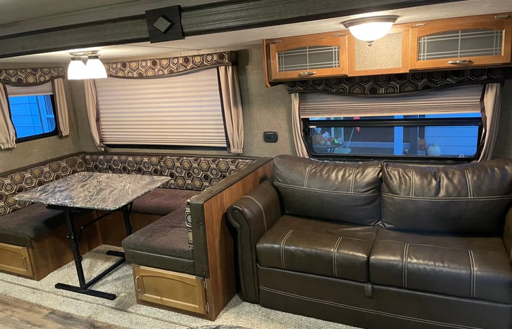 Couch and U-Shaped dinette, Both turn into beds for 1 large adult or 2 medium size adults.