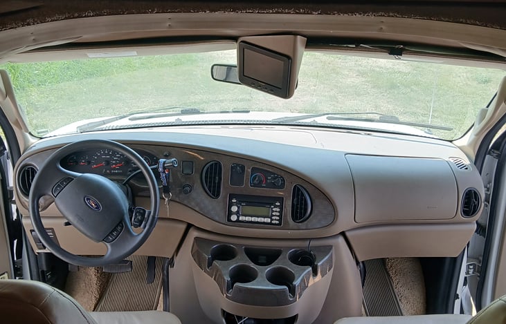 Spacious cabin with back-up camera and plenty of cup holders.