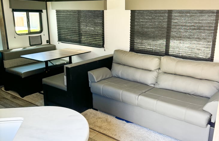 Couch and dining table that extend into a bed