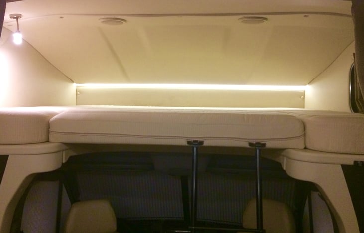 Sleeping loft area about driving compartment (42" by 80 inches).