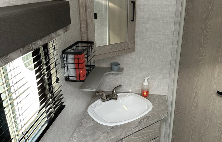 storage for the hair tools, personal items and a roomy cabinet to store items safetly for your trip. We stock the trailer with hand soap and hand towels as well.