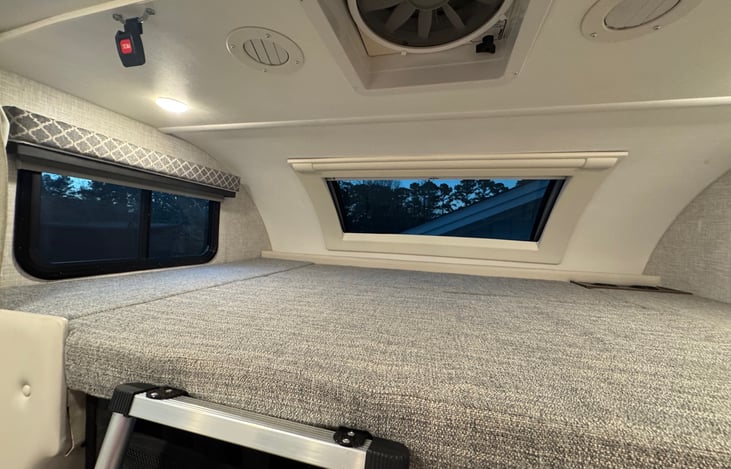 When used as a bed, we add a memory foam topper for extra comfort as well as a second set of sheets. There is a curtain/divider that can be pulled from either side to provide privacy to the space.