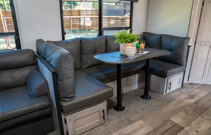 additional storage below the dinette with pull out bins for easy access to your personal items. This is a GREAT place to store everyone's shoes.