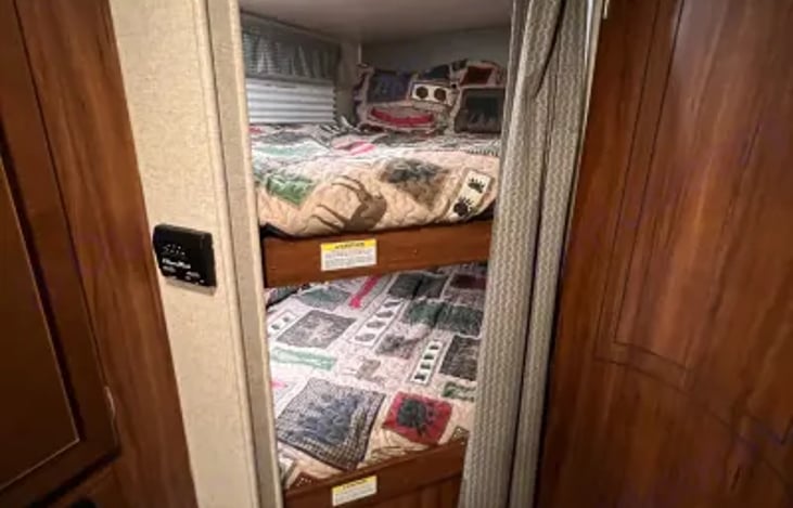 The bunk beds are both full size beds. They will each comfortably sleep two kids.