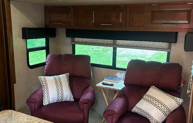 Slide out with 2 new lazy boy chairs.