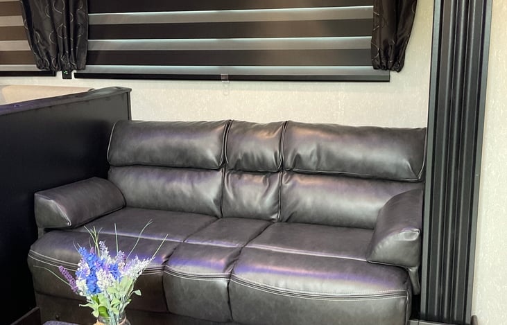 Jackknife sofa with Ottoman and rug