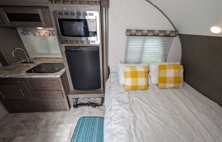 The kitchen dinette converts to a queen size bed with cozy foam topper!