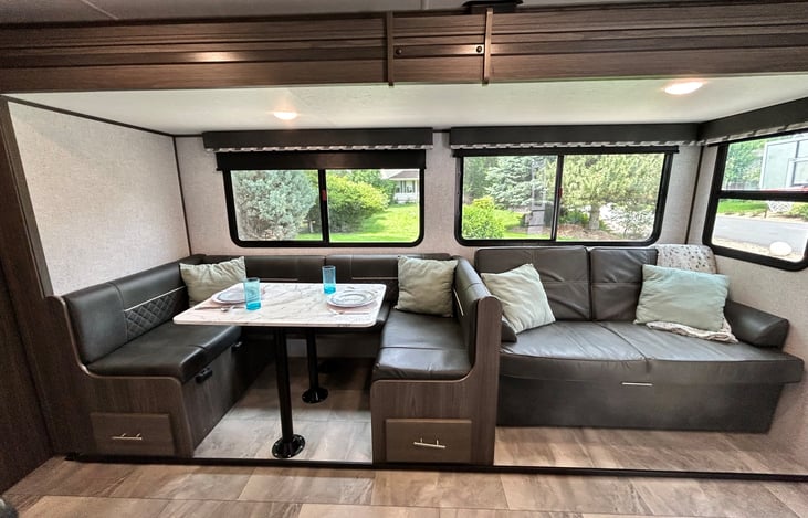 Dining table with fold-out couch