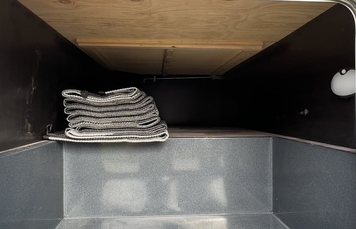 Large storage area under queen size bed