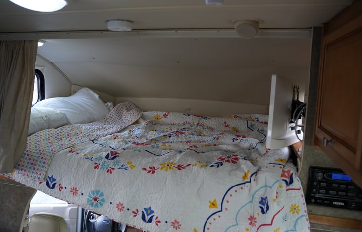 Up top queen bed. Does have ladder.