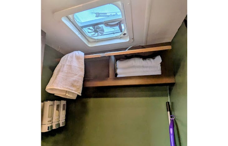 Storage above toilet
Additional towels and hand towels provided