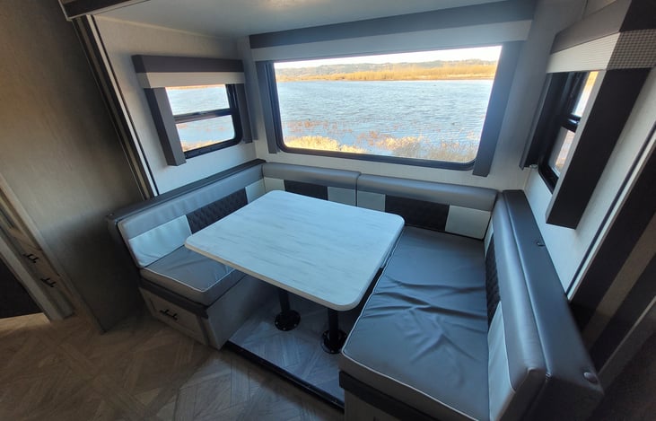 U-shaped table, which converts into a bed.