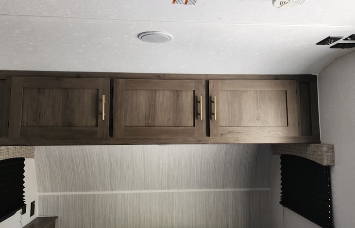 Storage for clothes over bed