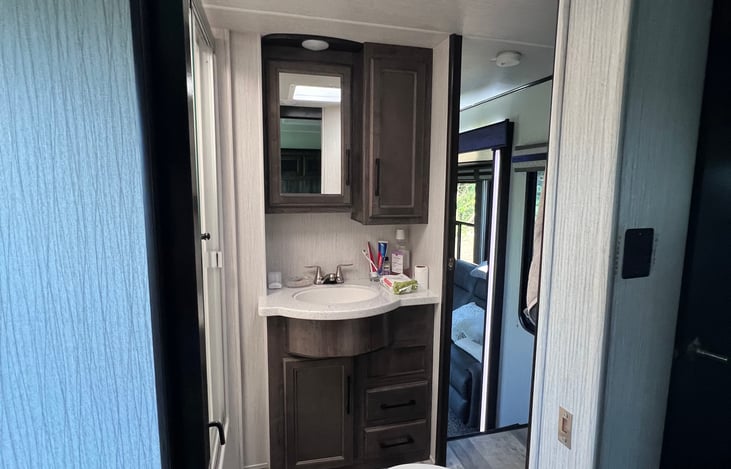 Main bathroom with a shower has a access from master bedroom and from the hallway.