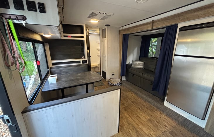 Dinning area with love seat that folds out (like a futon) for additional bed