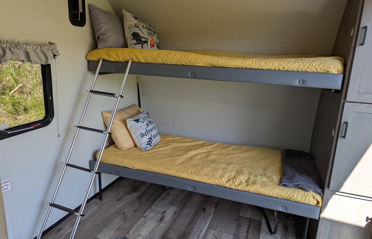 Spacious and versatile garage and bunk room has enough room for all your gear. Large ramp makes it easy to get all your gear in. Bunks flip up for more gear storage.