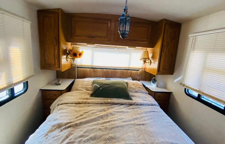 Our bedroom has a queen size bed with a memory foam matress topper! So comfy and lots of storage cabinets and drawers on each side of the bed. The Blinds come down on all sides giving you darkness.