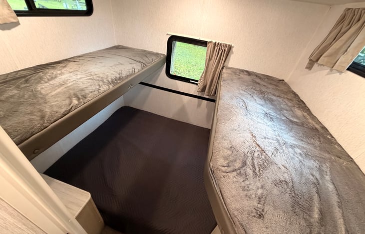 Bunkhouse with bunks ready and couch folded down into the bed position!