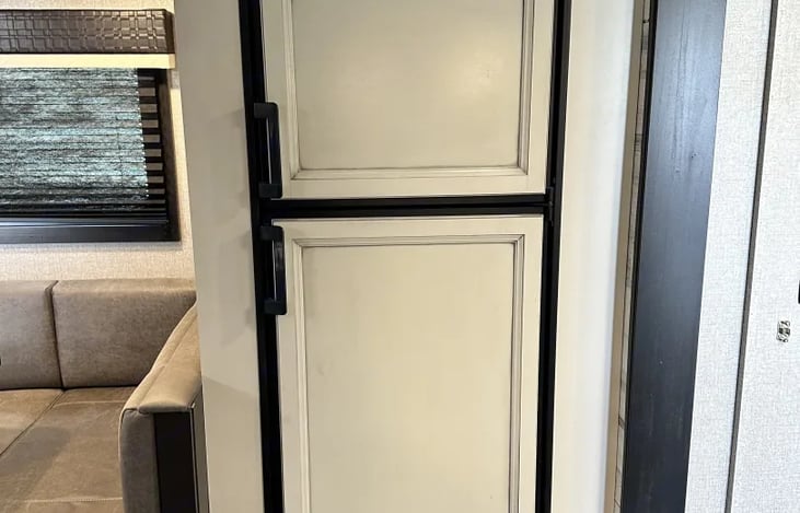 Small apartment size refrigerator with freezer for all your food. whitewash farm style to match.