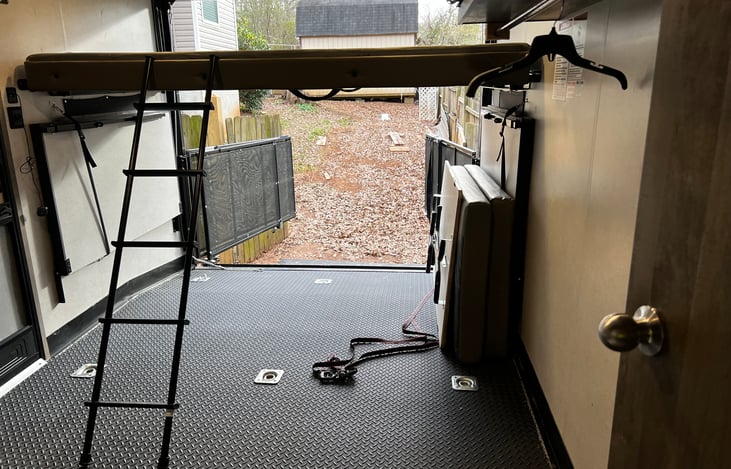 Full-size top bunk that holds 350lbs max.
