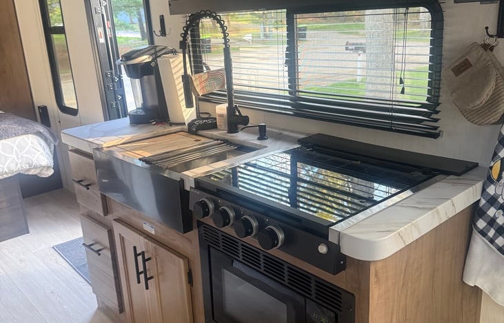 Fully equipped kitchen with microwave/convection oven/air fryer and 3 burner stove. Large 10 cubic foot residential style refrigerator.